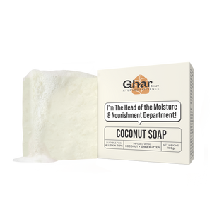 A bar of white coconut soap is shown next to its packaging, which reads "Coconut Soap" and highlights moisture and nourishment benefits.